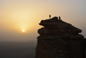 Two men standing at the edge of the world.