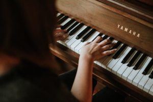 woman playing a piano