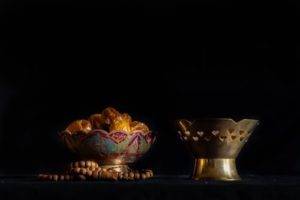 Dates served in a blue and gold bowl