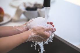 A person washing hands.